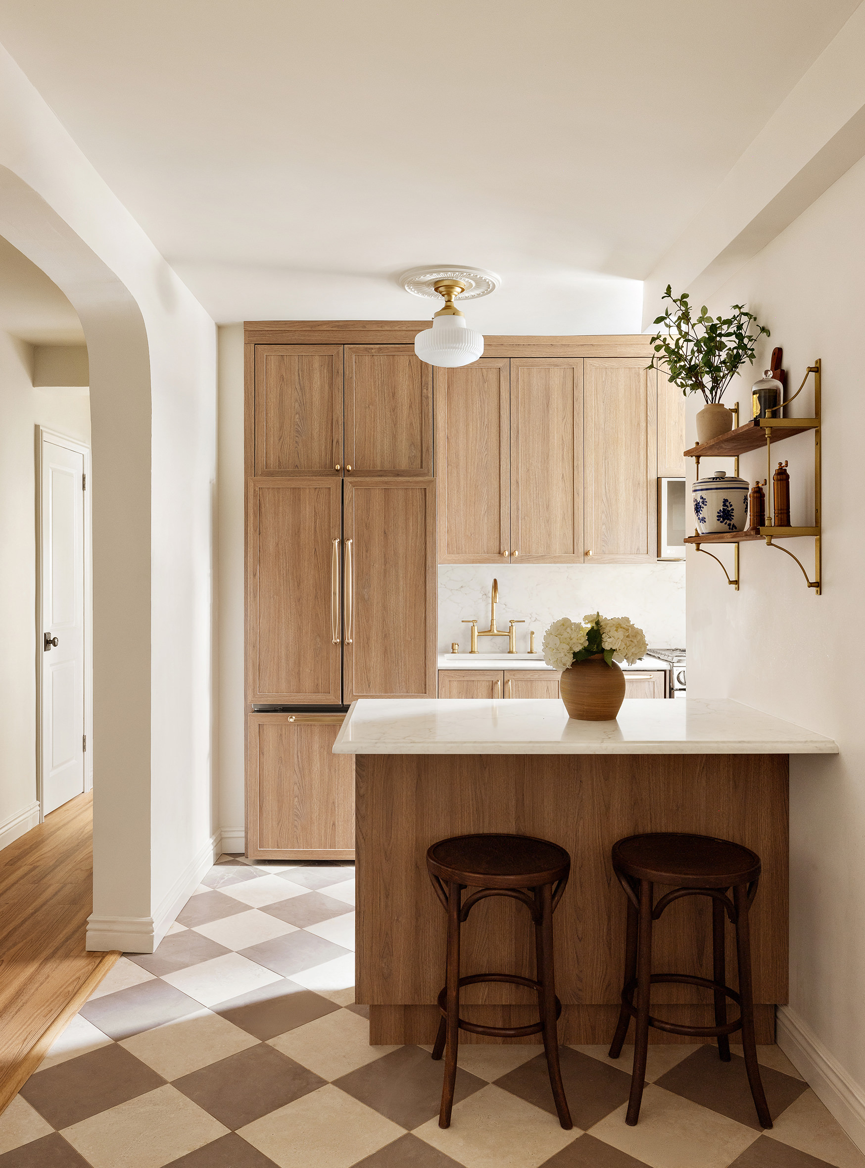201 Clinton Avenue, Unit 1G Brooklyn, NY 11205 - Photo 2 of 9 a view of a kitchen with a dining table and chairs