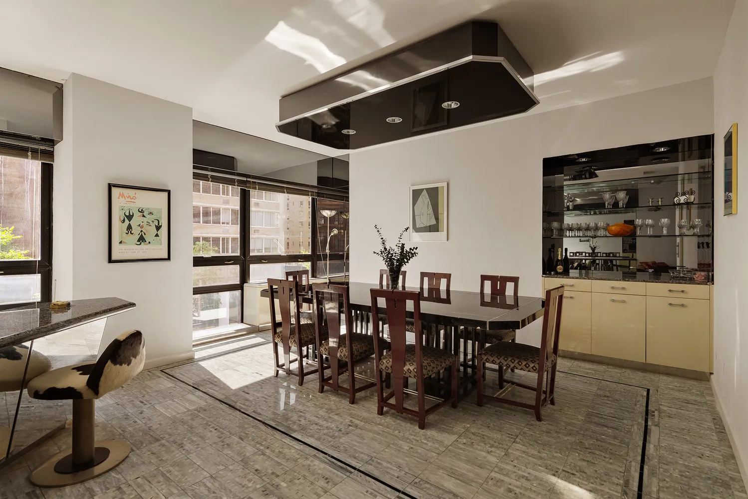 a dining room with furniture and window