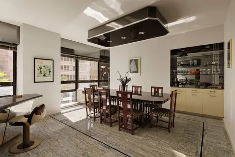 a dining room with furniture and window