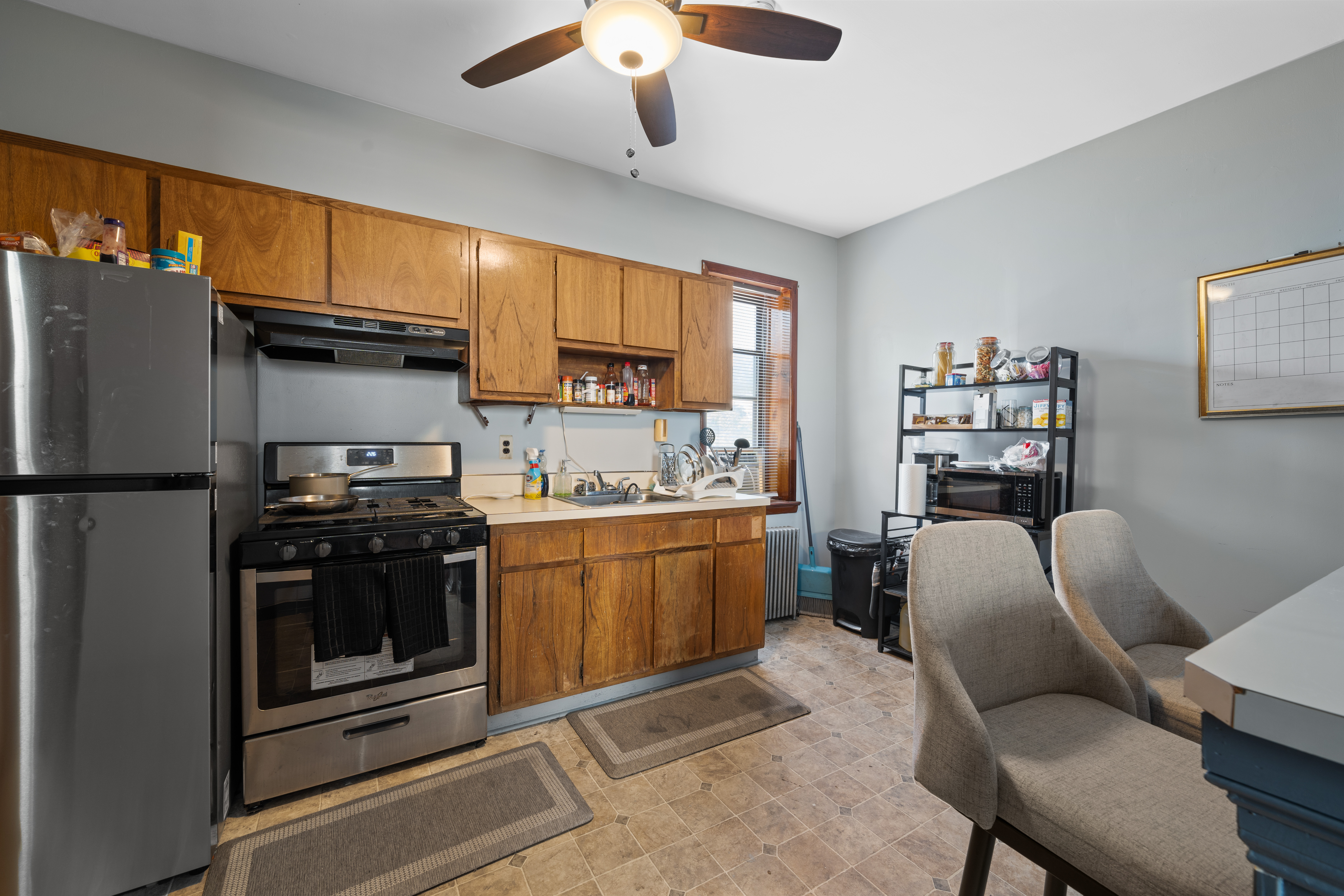 162 Mallory Avenue Jersey City, NJ 07304 - Photo 17 of 29 a kitchen with stainless steel appliances granite countertop a refrigerator stove top oven a sink and dishwasher