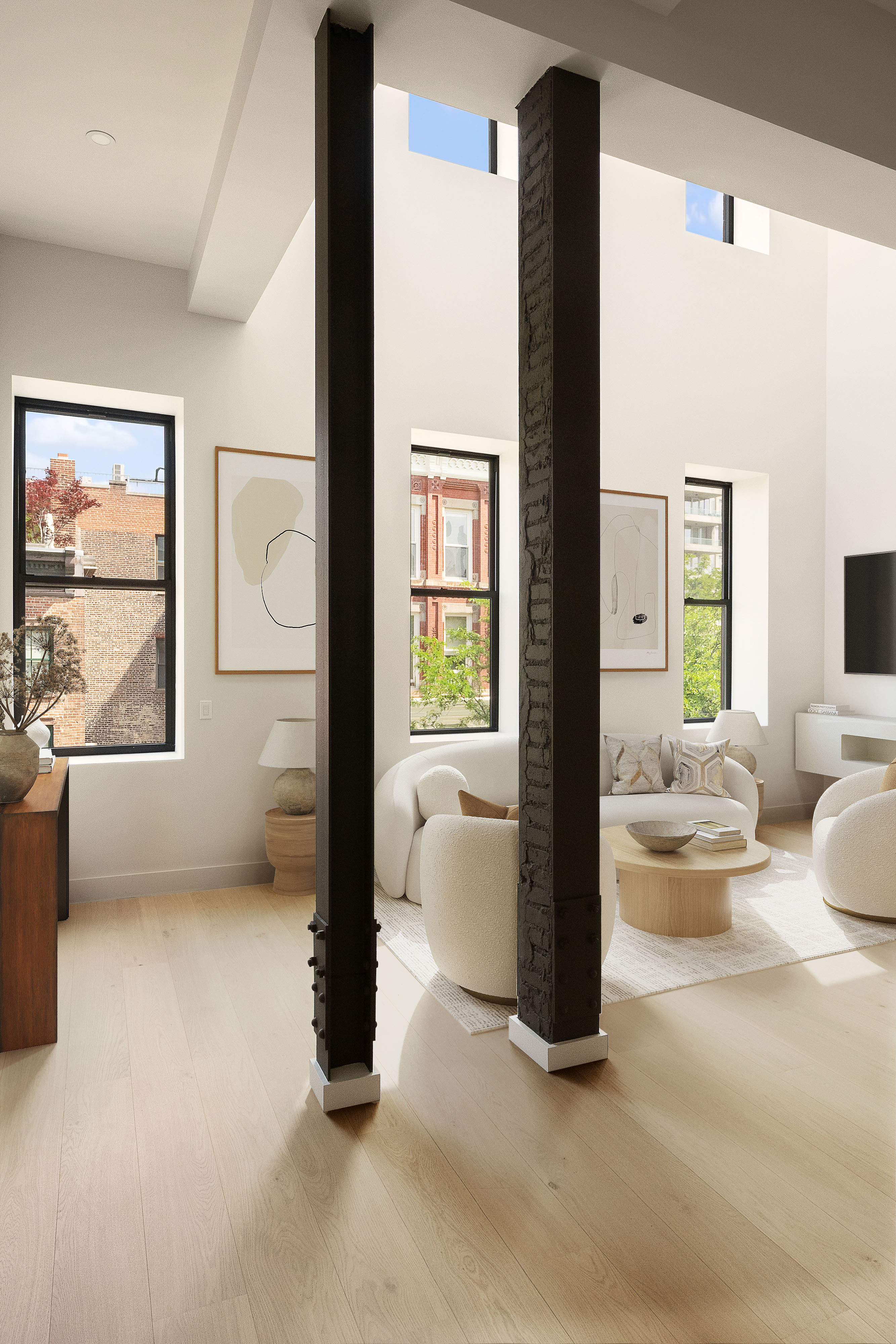 216 Grand Street, Unit LOFT 5 Brooklyn, NY 11211 - Photo 4 of 12 a living room with furniture and a large window