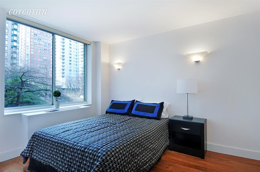 220 East 65th Street, Unit 3K Manhattan, NY 10065 - Photo 4 of 13 a bedroom with a bed and window