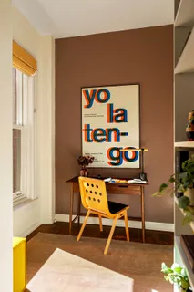 a view of a livingroom with furniture and a window