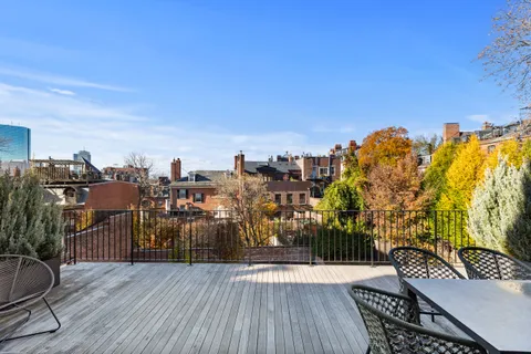 a view of roof deck with patio