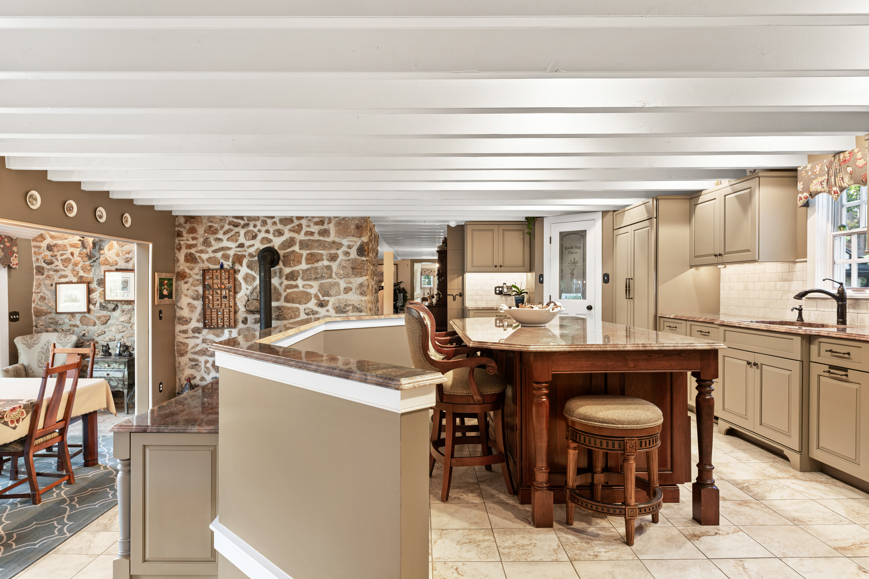 791 Grubbs Mill Road Berwyn, PA 19312 - Photo 16 of 76 a view of living room kitchen with stainless steel appliances granite countertop furniture and a fireplace