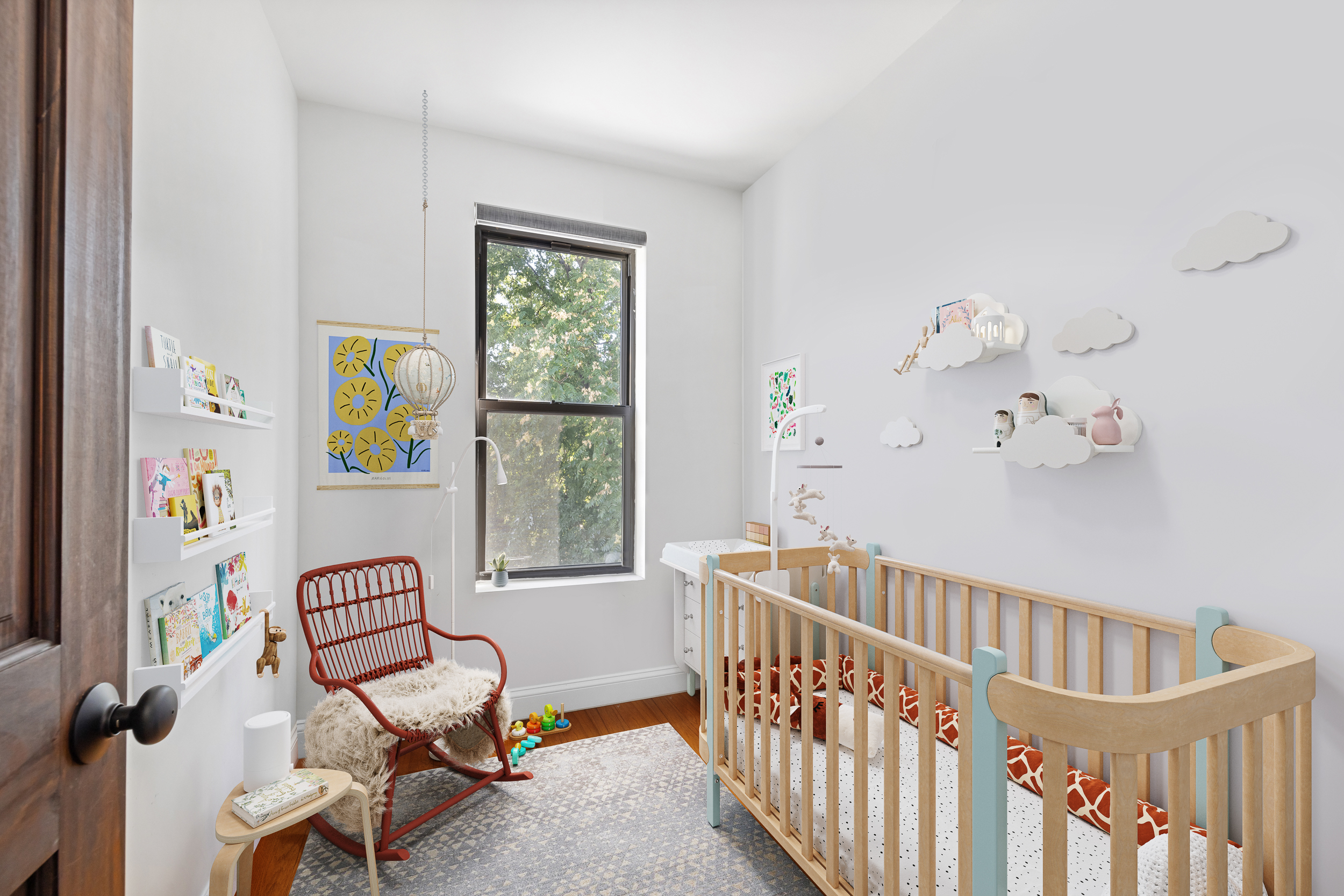 716 Monroe Street Brooklyn, NY 11221 - Photo 13 of 22 a bedroom with furniture and a window