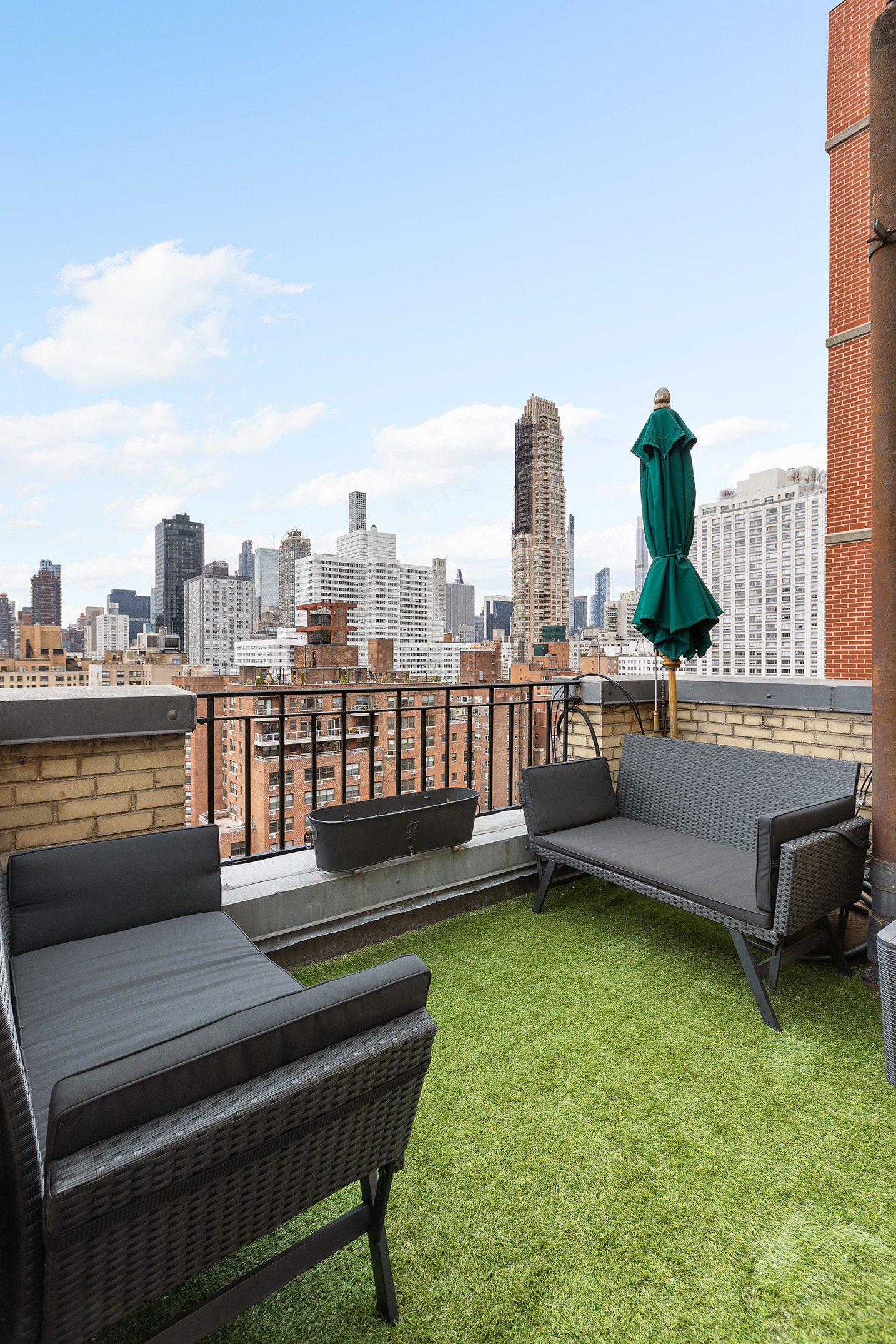320 East 72nd Street, Unit PHB Manhattan, NY 10021 - Photo 15 of 26 a view of a terrace with lawn chairs and a table
