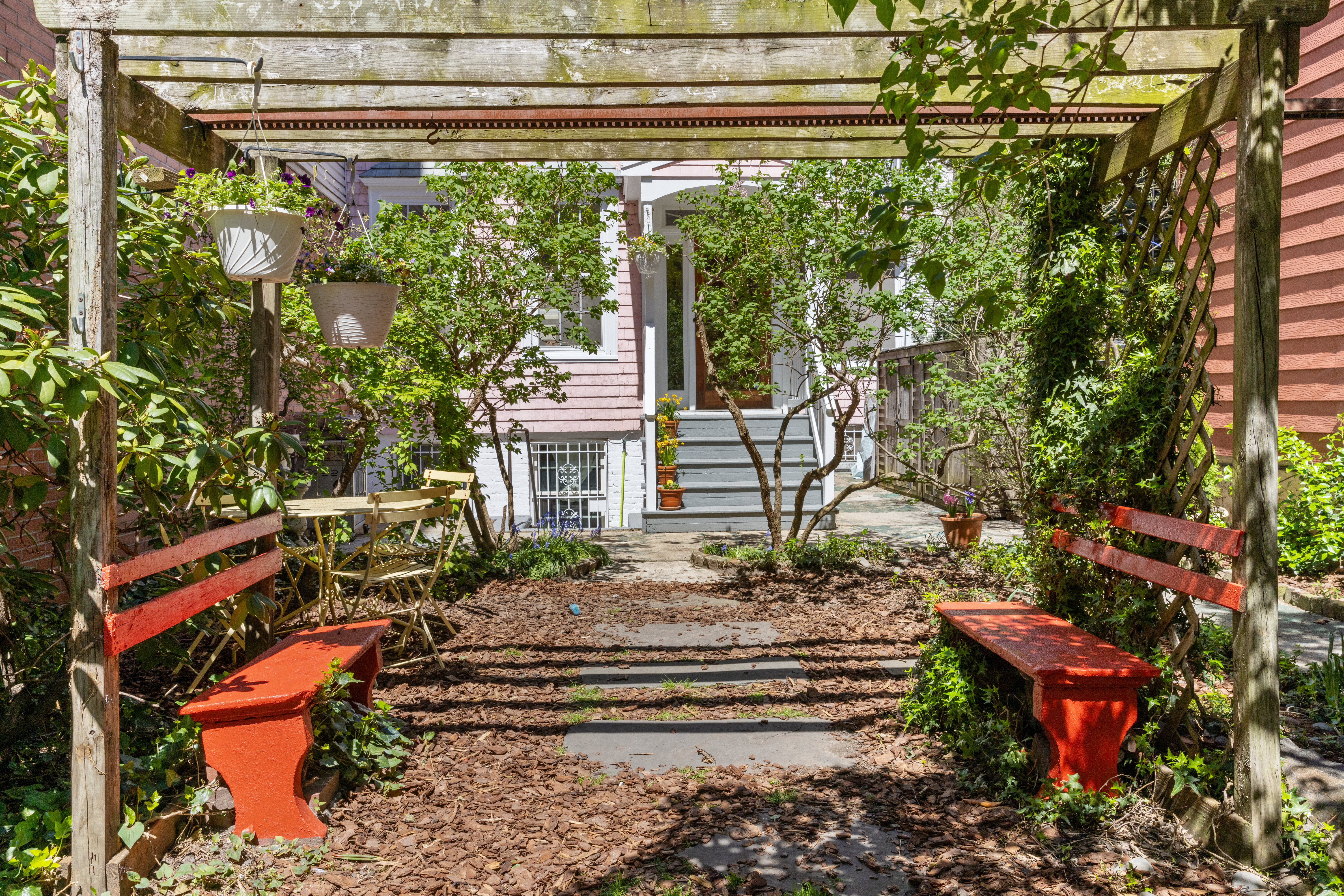 61 Norman Avenue Brooklyn, NY 11222 - Photo 2 of 22 a view of a bench in a back yard of the house