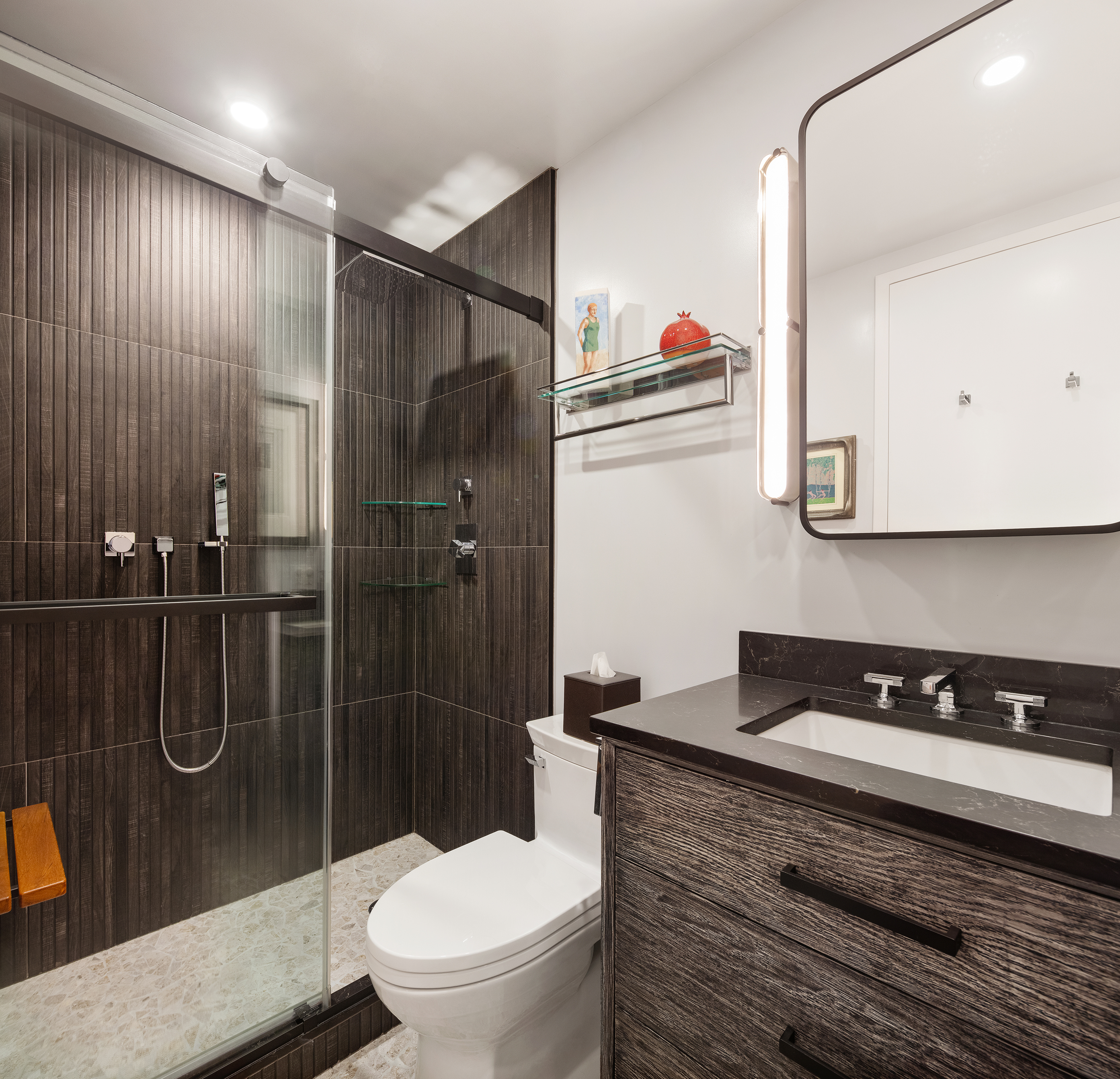 225 West 83rd Street, Unit 19A Manhattan, NY 10024 - Photo 8 of 15 a bathroom with a toilet a sink and shower