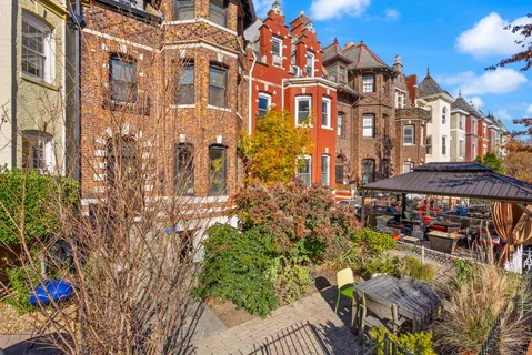a view of a balcony with a tree