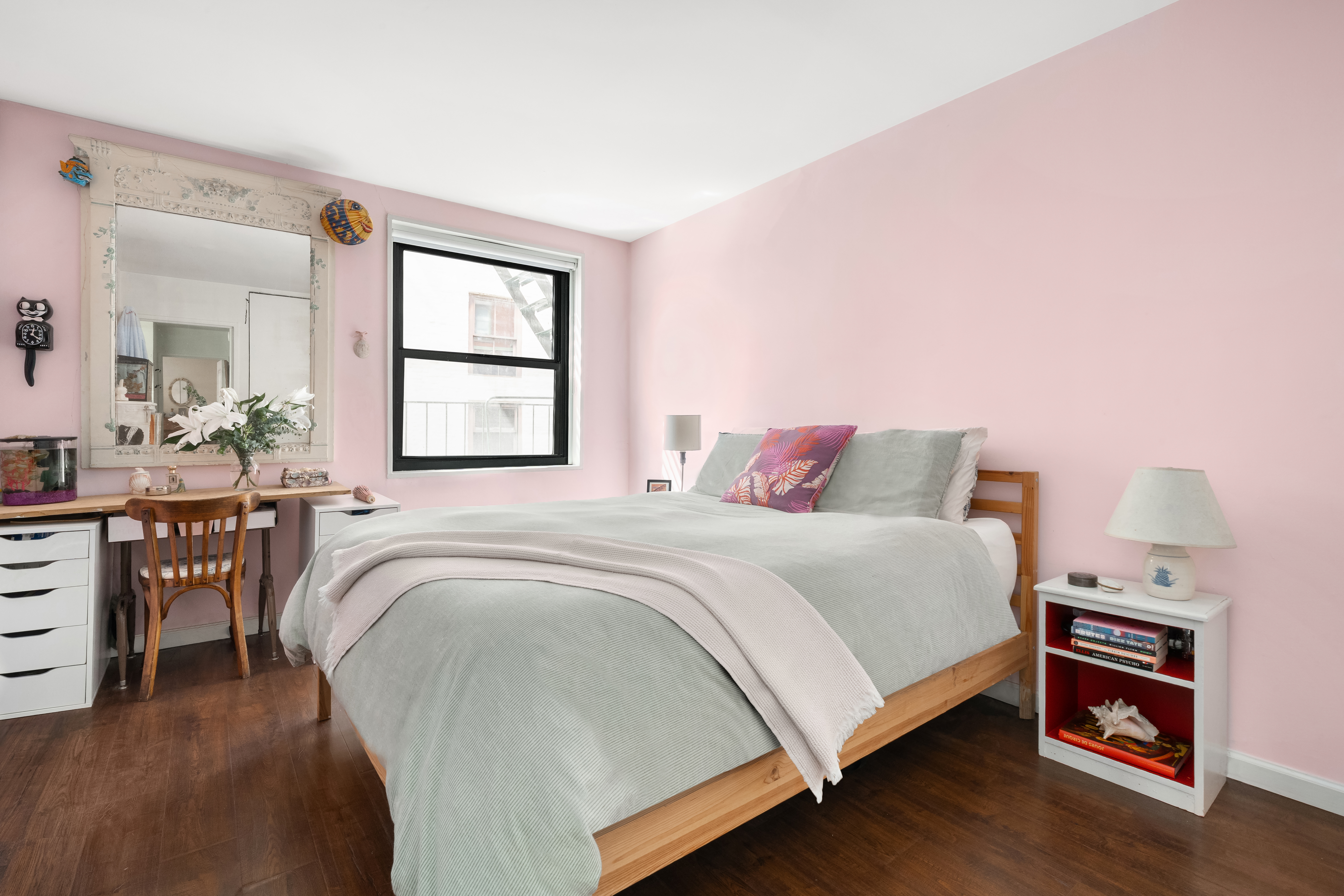 634 Washington Street, Unit 4B Manhattan, NY 10014 - Photo 9 of 12 a bedroom with a bed and wooden floor