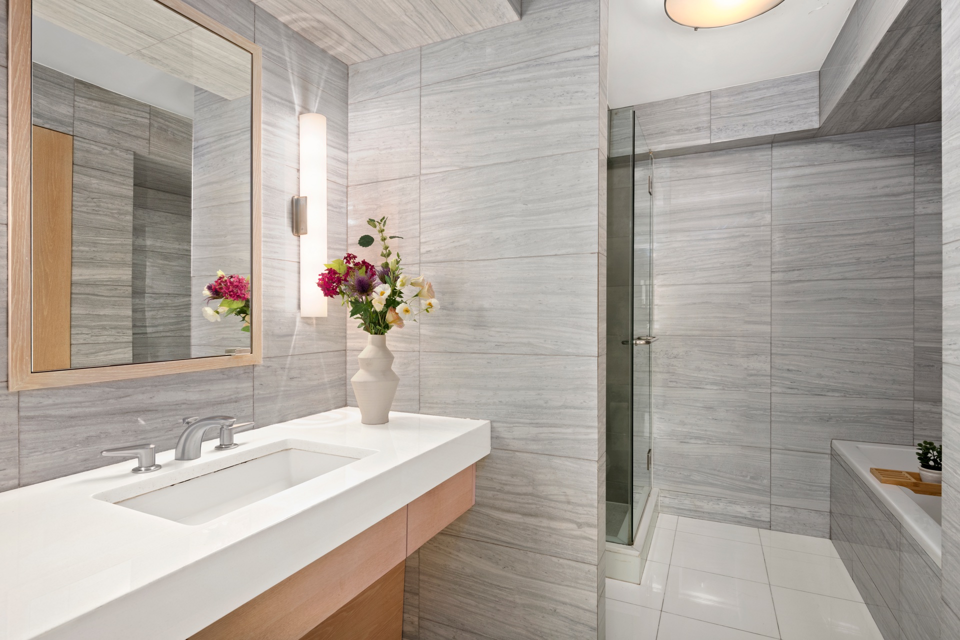 142 East 16th Street, Unit 22B Manhattan, NY 10003 - Photo 10 of 15 a bathroom with a sink and a mirror