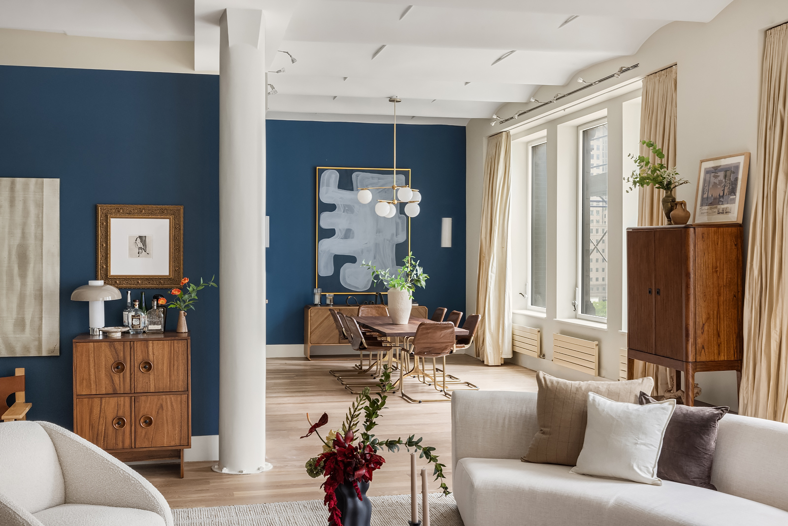 a living room with furniture a lamp and a window
