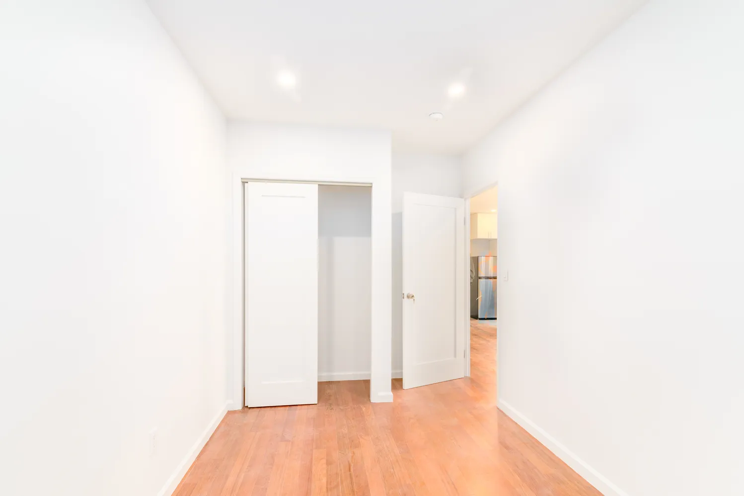 a view of a room with a hallway