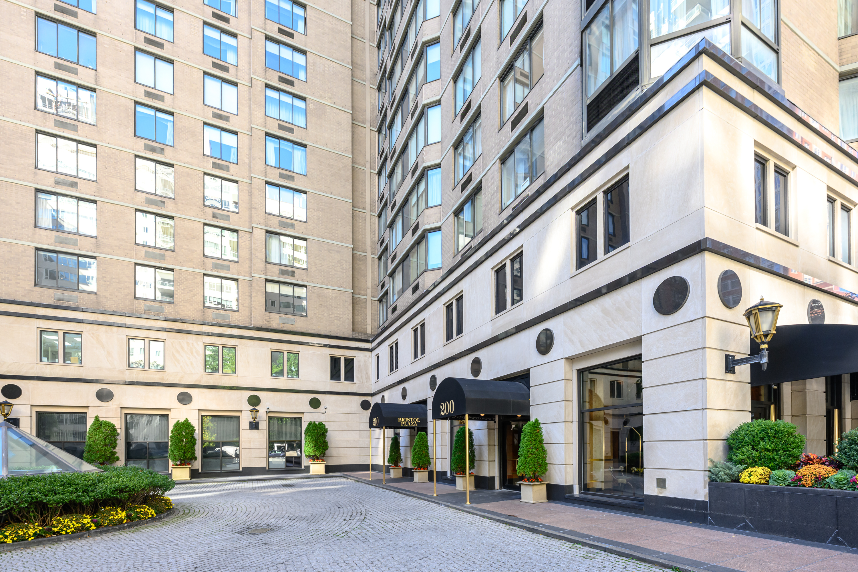 200-210 East 65th Street, Unit 11D Manhattan, NY 10065 - Photo 14 of 15 a view of a building with a street