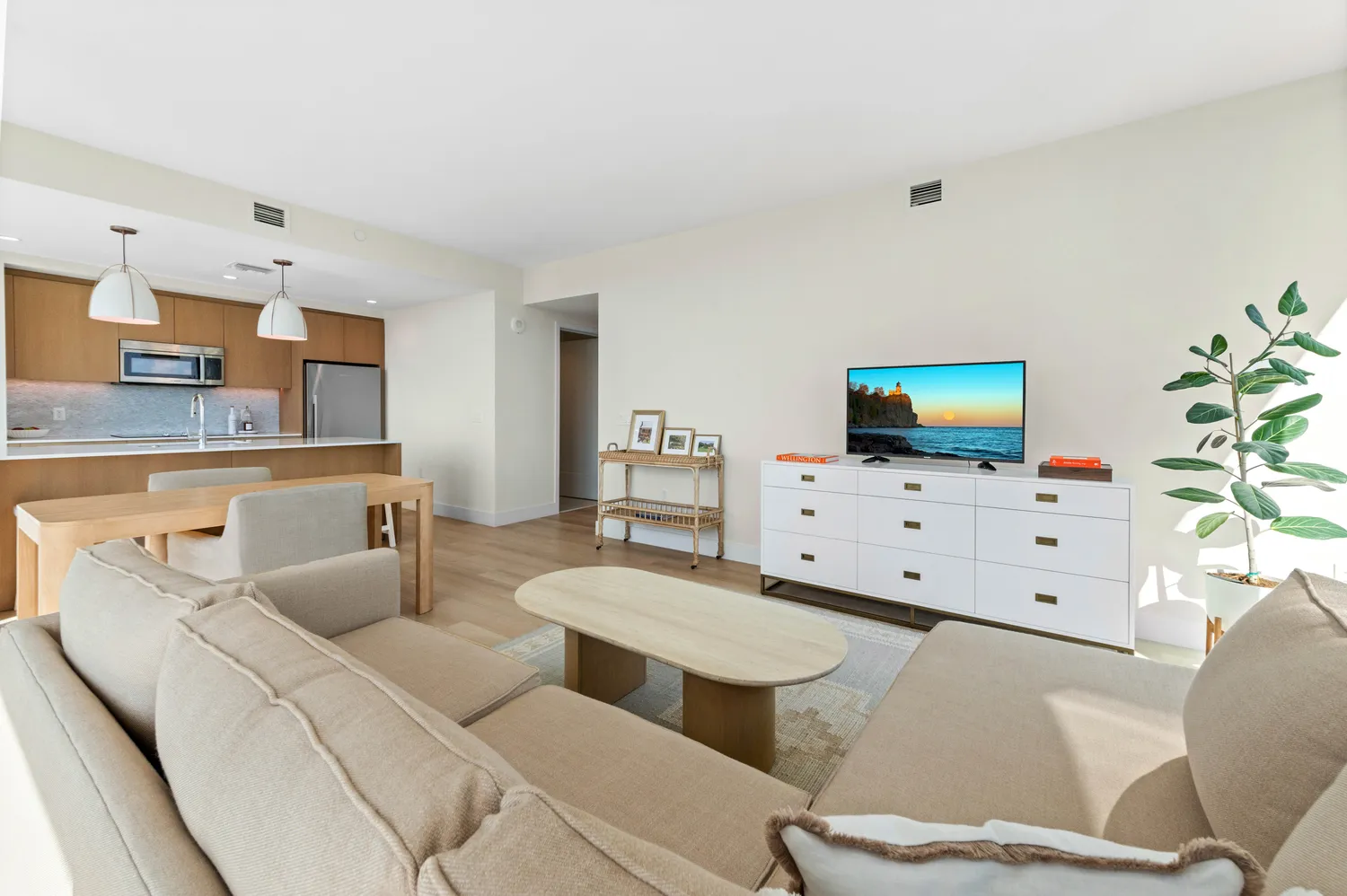 a living room with furniture a lamp and a table