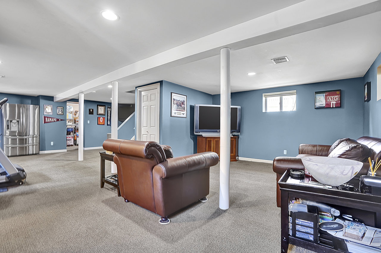 266 Feronia Way Rutherford, NJ 07070 - Photo 32 of 41 a living room with furniture and a flat screen tv