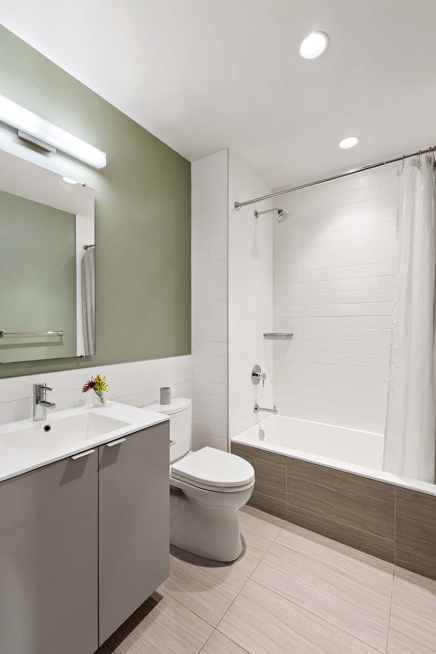 27 Clermont Avenue Brooklyn, NY 11205 - Photo 15 of 19 a bathroom with a bathtub shower sink mirror and toilet