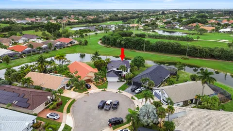 an aerial view of a house with a yard and plants
