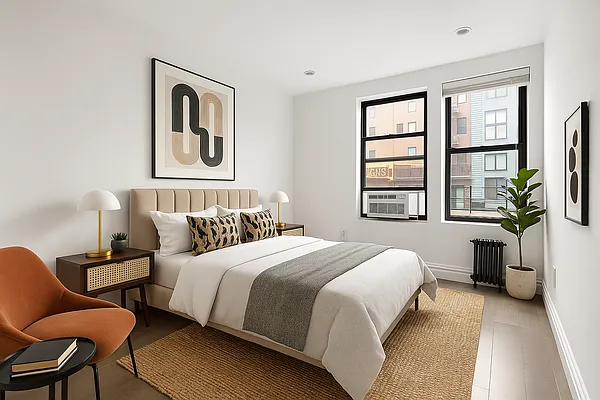 20 Avenue A, Unit 3AB Manhattan, NY 10009 - Photo 6 of 13 a bedroom with a bed and a chair