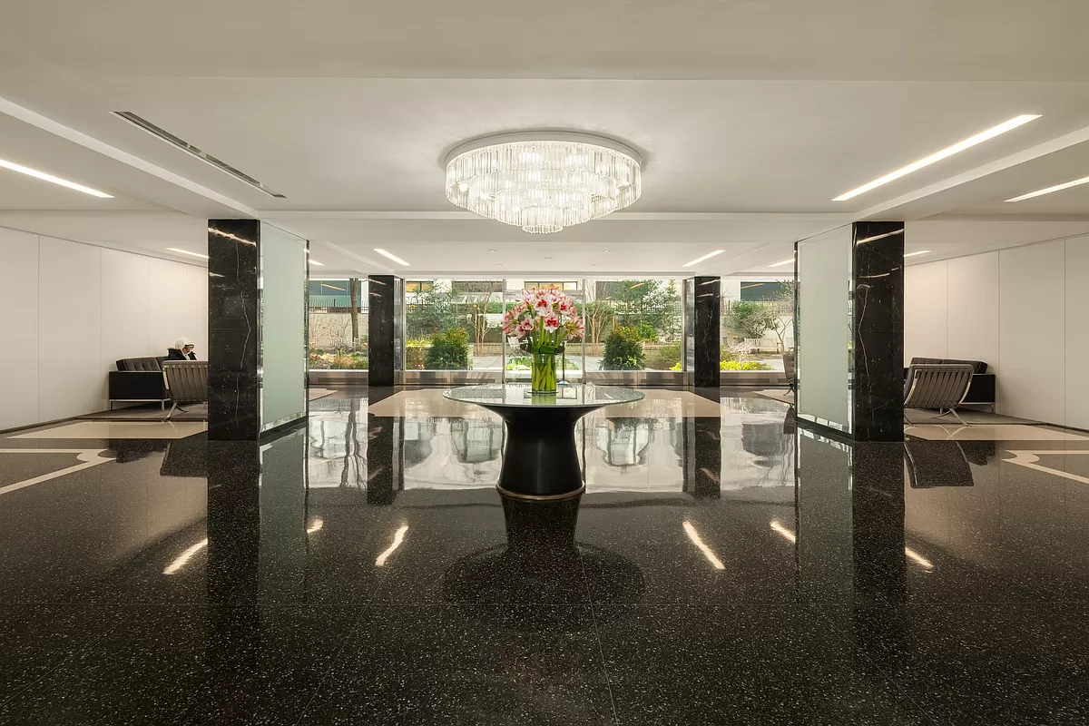 70 East 10th Street, Unit 3M Manhattan, NY 10003 - Photo 11 of 14 a dining room with furniture water view and a floor to ceiling window