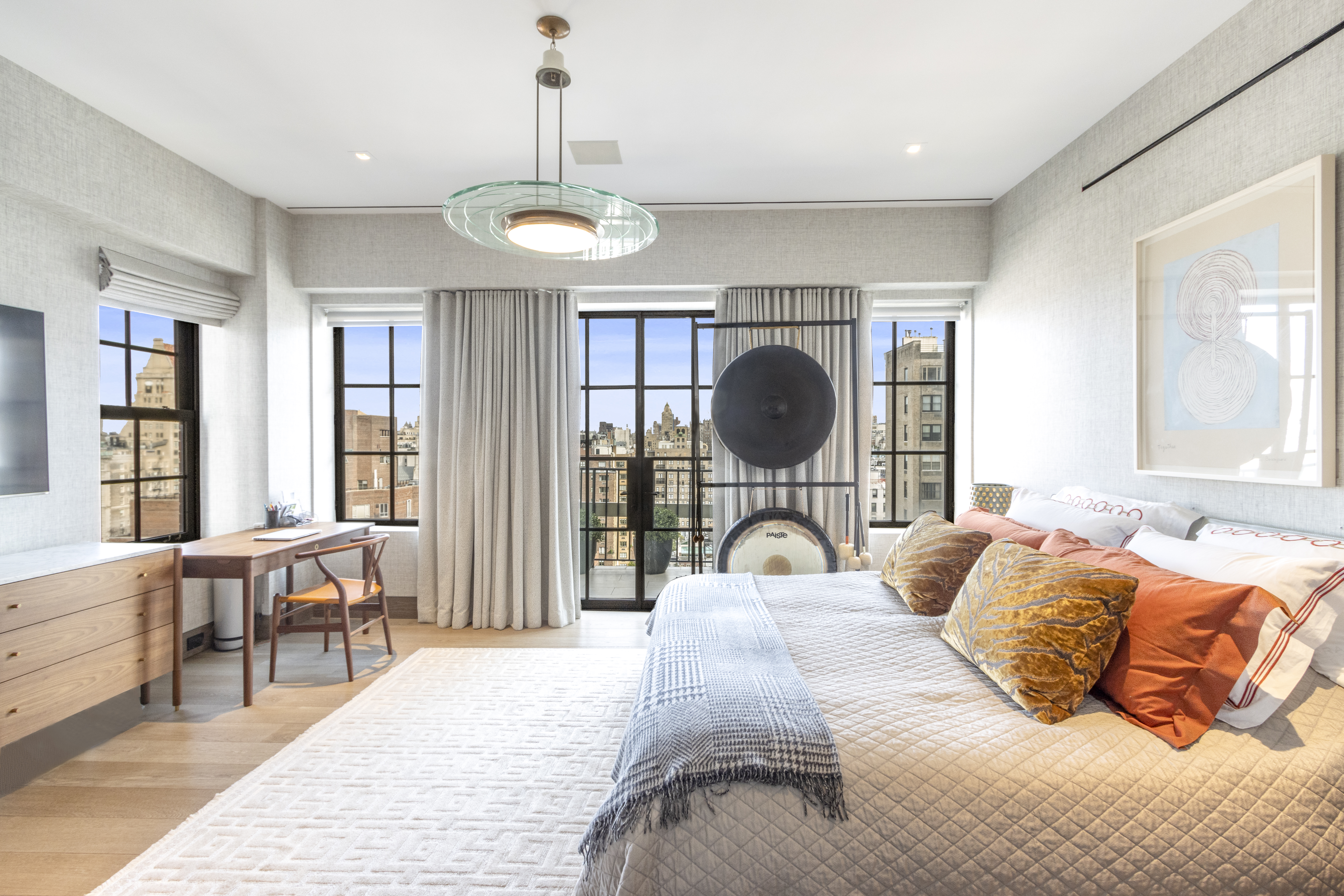 40 East 61st Street, Unit 18A Manhattan, NY 10065 - Photo 7 of 15 a bedroom with a large bed and a large window