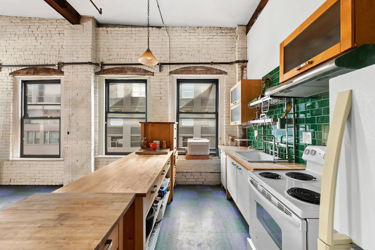 a kitchen that has a lot of cabinets in it