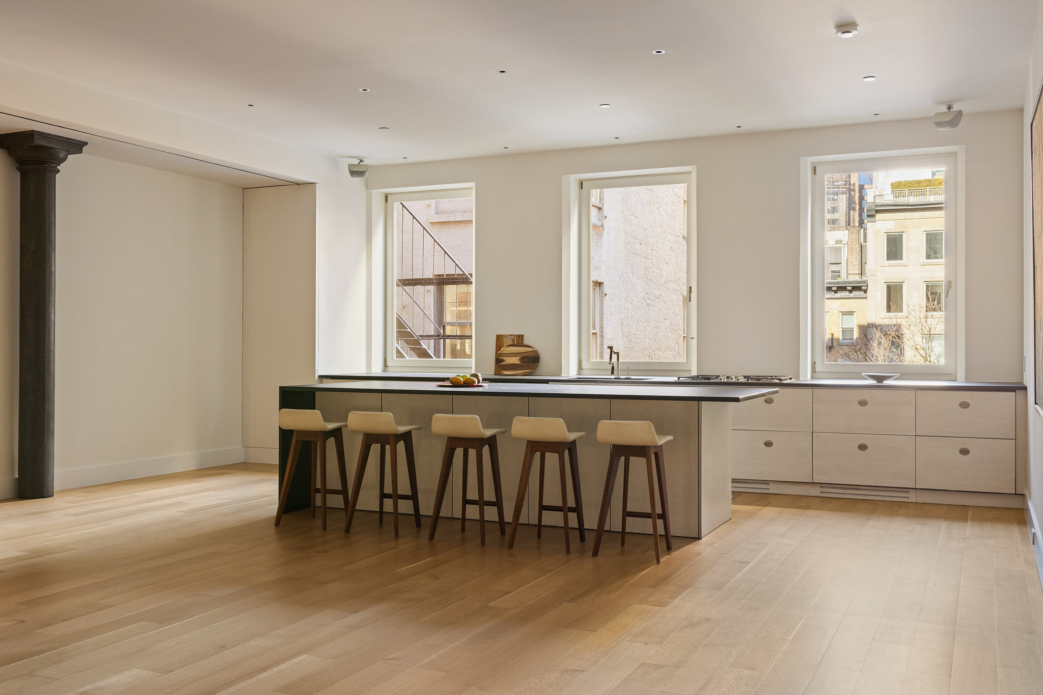 101 Wooster Street, Unit 3F/4F Manhattan, NY 10012 - Photo 4 of 24 a large white kitchen with a window