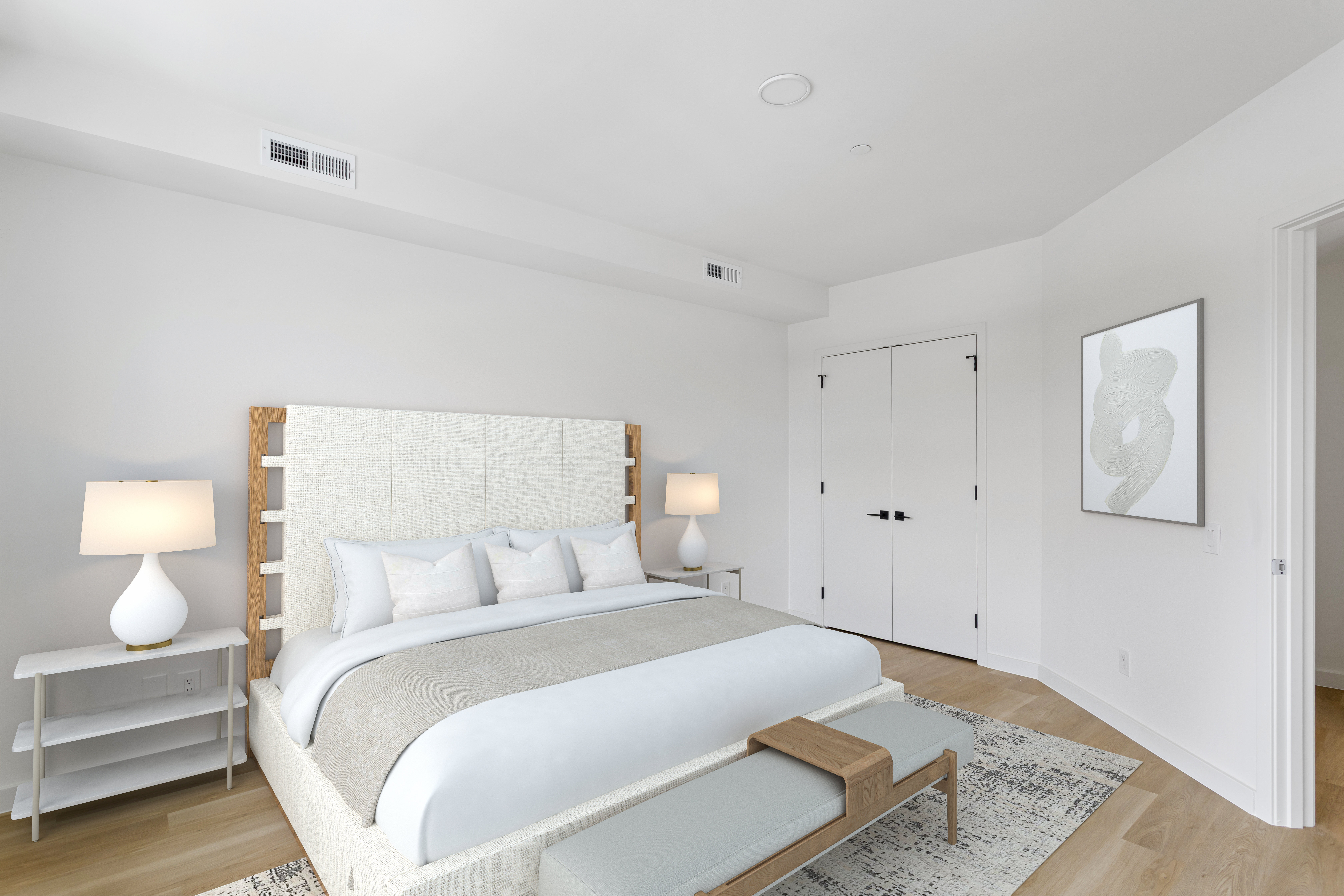 3144 Emmons Avenue, Unit 102 Brooklyn, NY 11235 - Photo 5 of 12 a bedroom with a bed and lamps