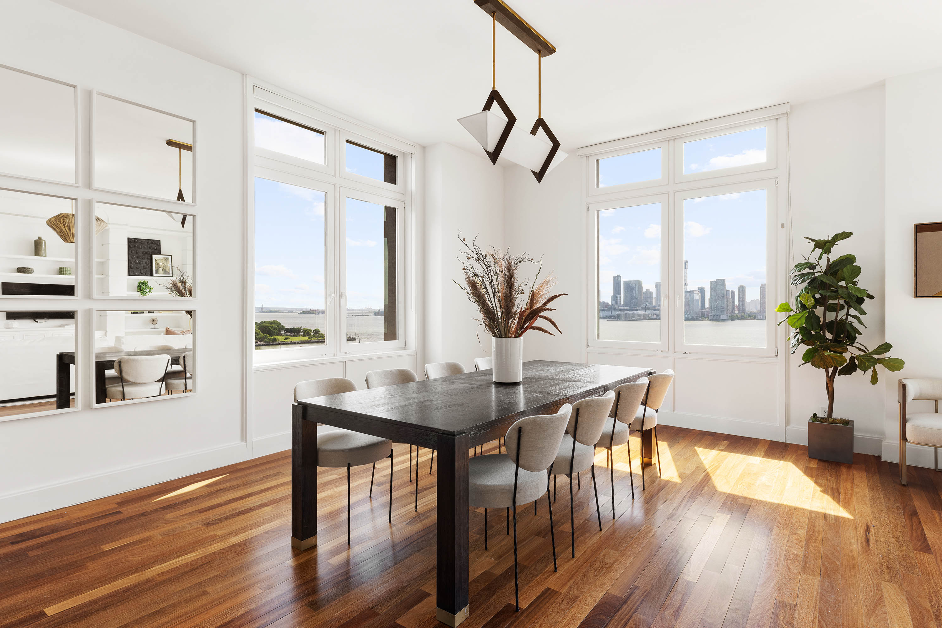 92 Laight Street, Unit 11A Manhattan, NY 10013 - Photo 3 of 15 a view of a dining room with furniture and wooden floor