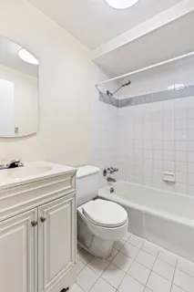 a bathroom with a sink a toilet and a bathtub