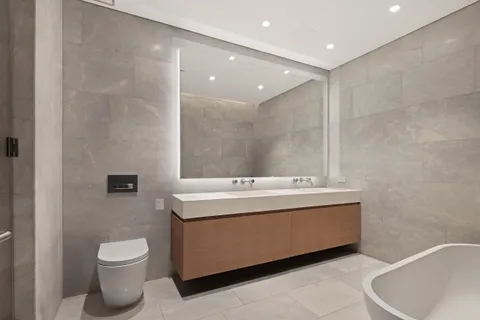 a bathroom with a toilet a sink and a bathtub