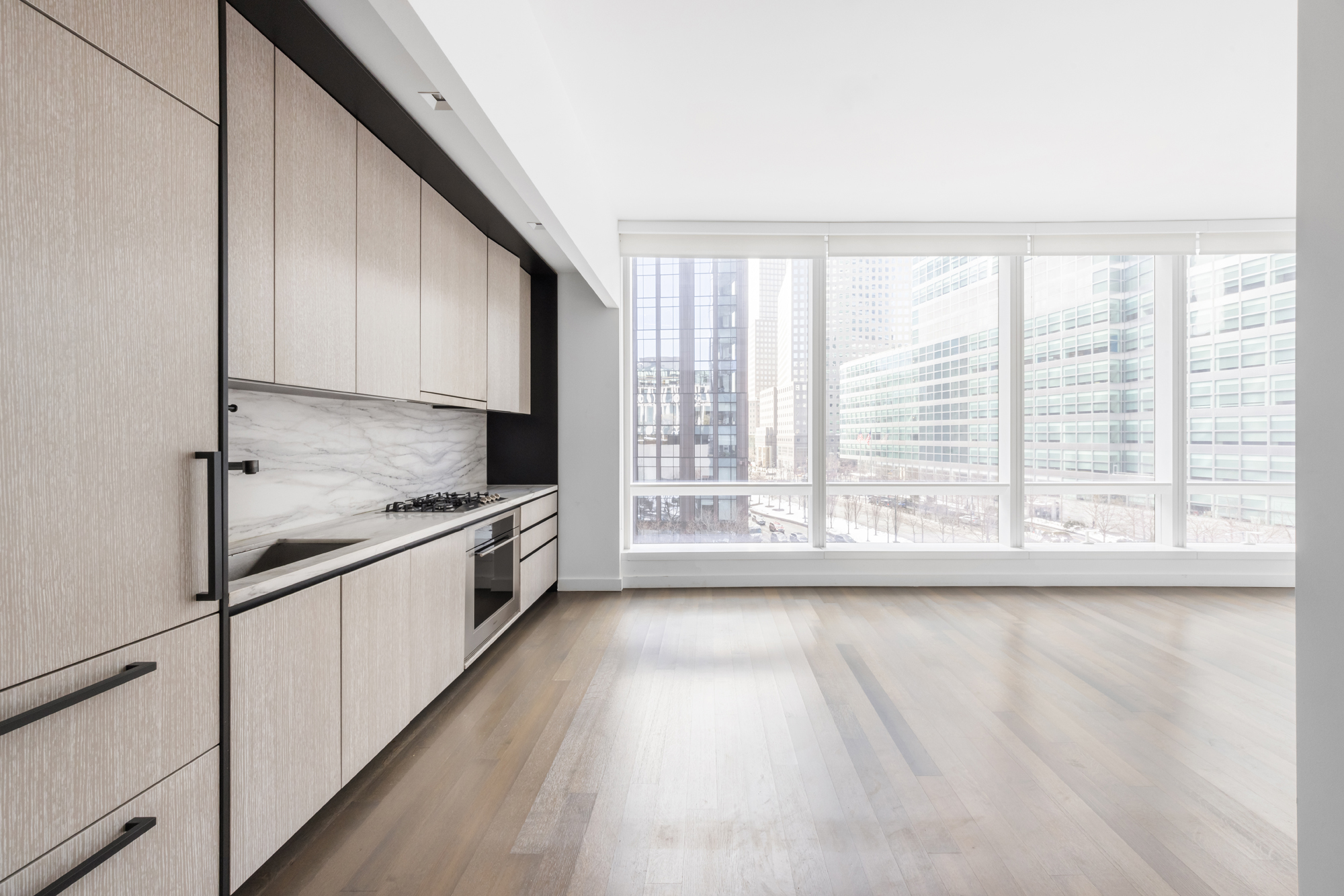 111 Murray Street, Unit 7D Manhattan, NY 10007 - Photo 2 of 17 a large kitchen with granite countertop a lot of counter space and wooden floor