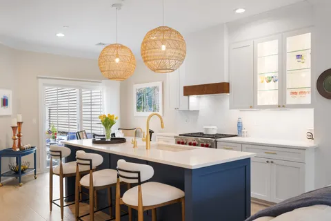a kitchen with a sink cabinets and window