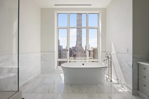 a view of a bathroom with bathtub