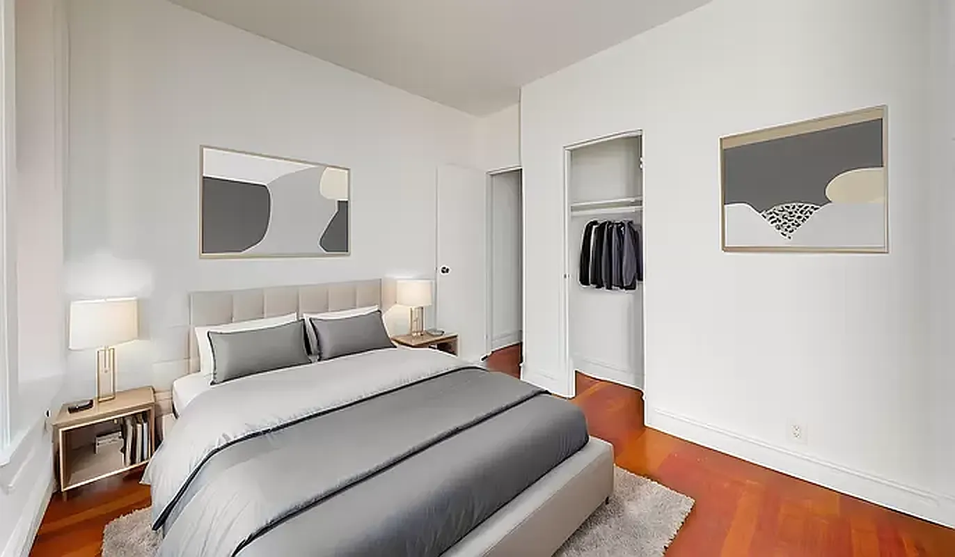 545 East 5th Street, Unit 3 Manhattan, NY 10009 - Photo 3 of 4 a bedroom with a bed wooden floor and painting on the wall