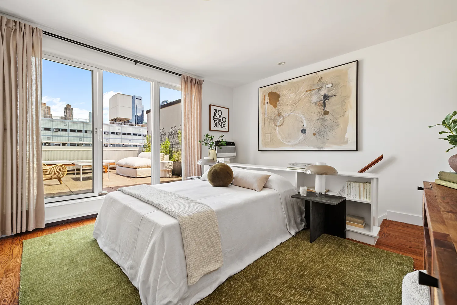 a spacious bedroom with a large bed and a large window