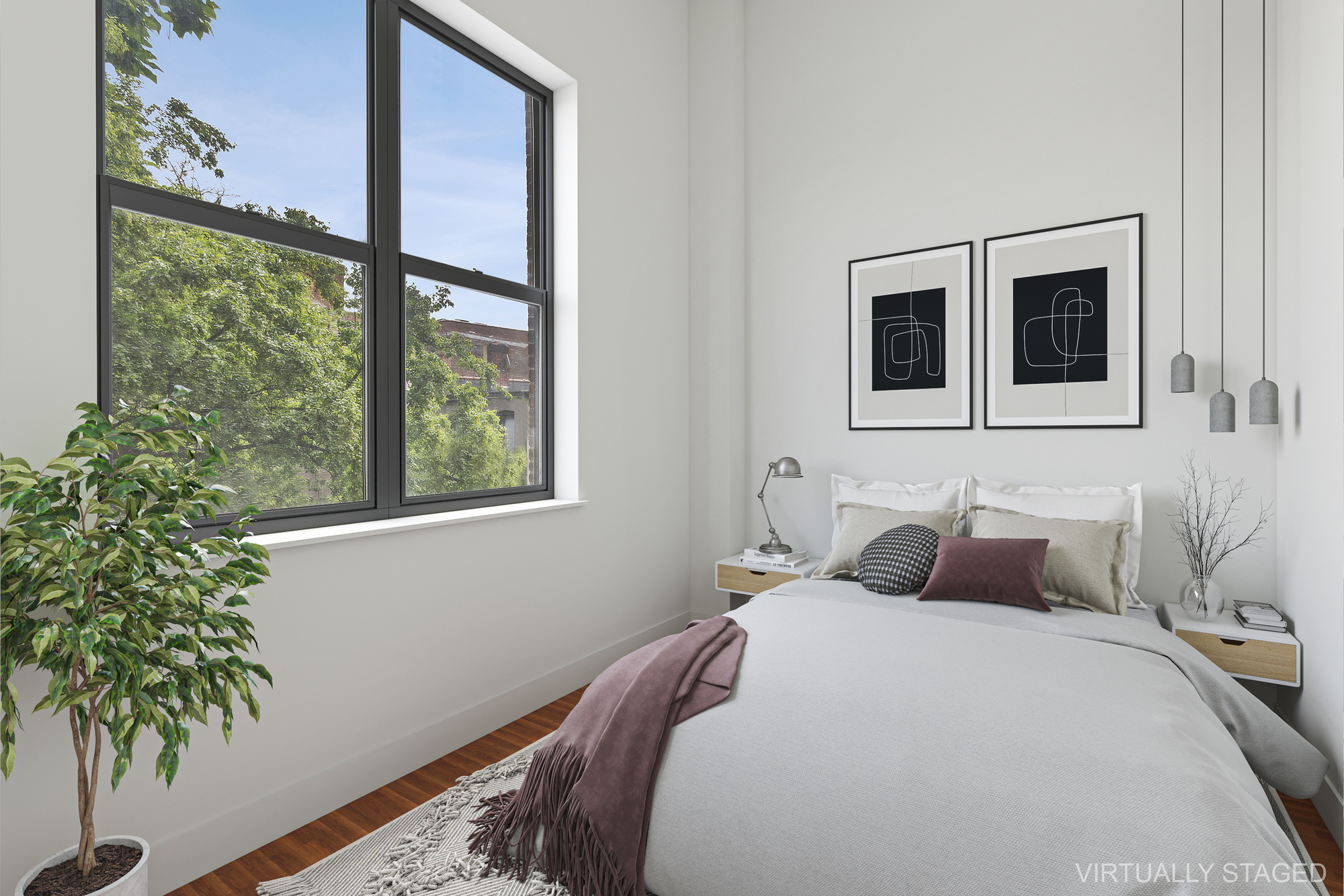 180 Bainbridge Street, Unit 106 Brooklyn, NY 11233 - Photo 5 of 22 a bedroom with a large bed and a potted plant