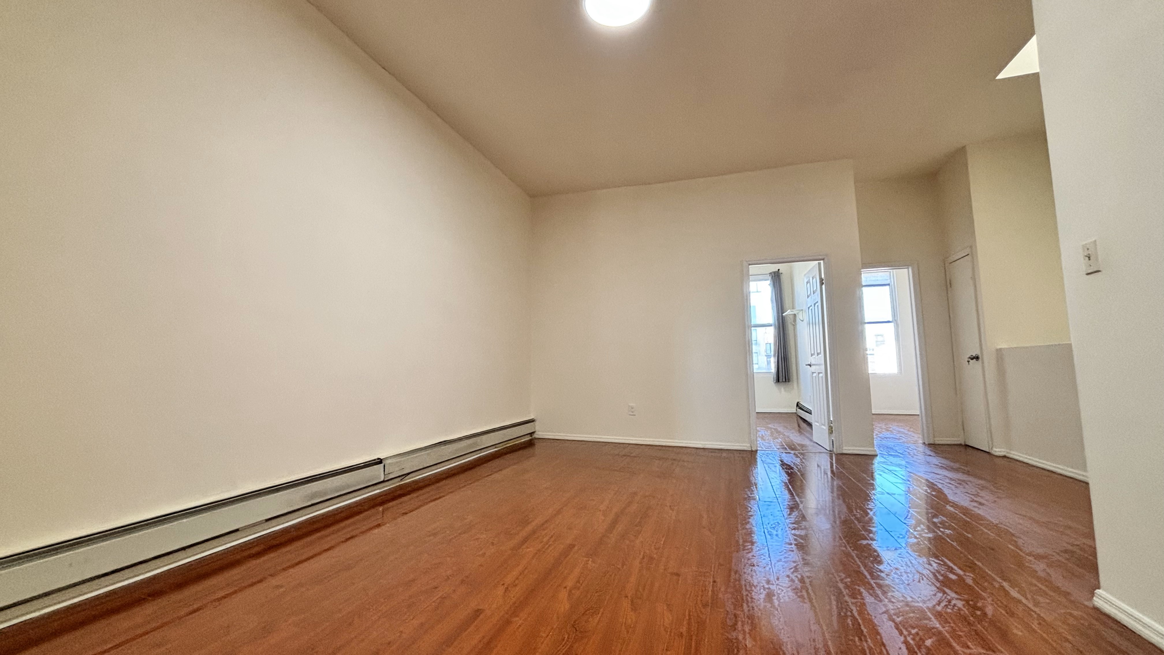 74 Himrod Street, Unit 2 Brooklyn, NY 11221 - Photo 6 of 16 a big room with wooden floor