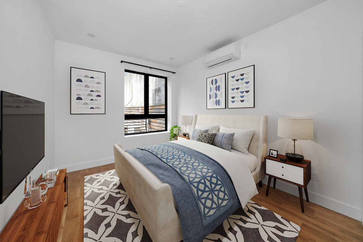 79 Clay Street, Unit 1R Brooklyn, NY 11222 - Photo 6 of 10 a bedroom with a bed and wooden floor