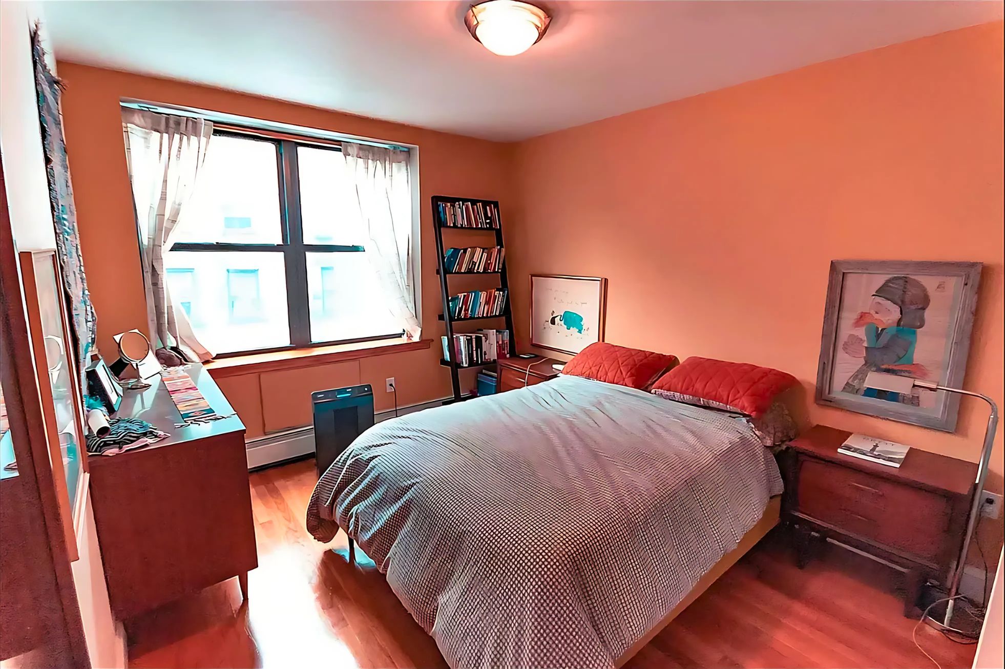 133 Essex Street, Unit 403 Manhattan, NY 10002 - Photo 3 of 7 a bedroom with a bed and wooden floor