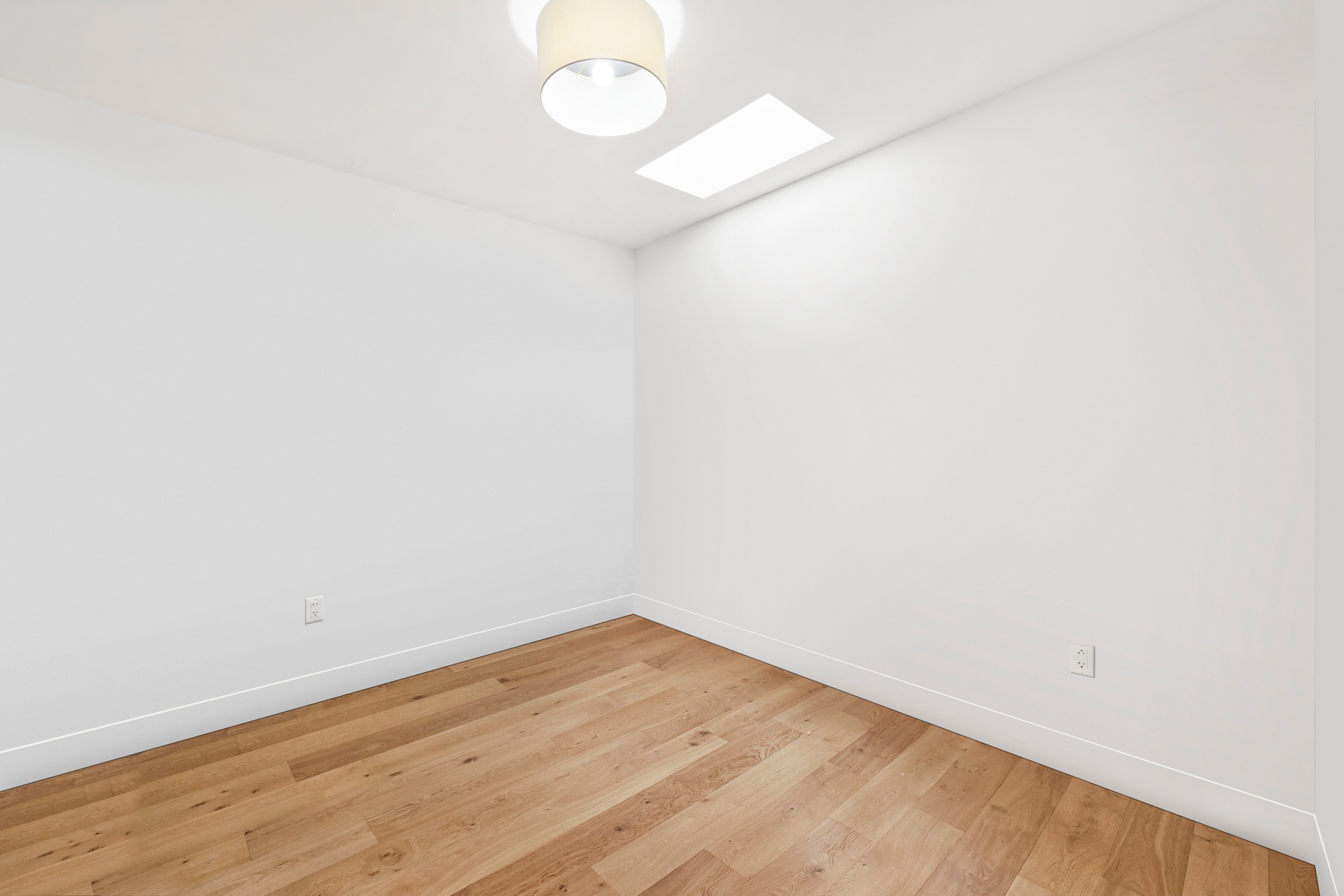 65 Bainbridge Street Brooklyn, NY 11233 - Photo 15 of 24 a view of empty room with wooden floor