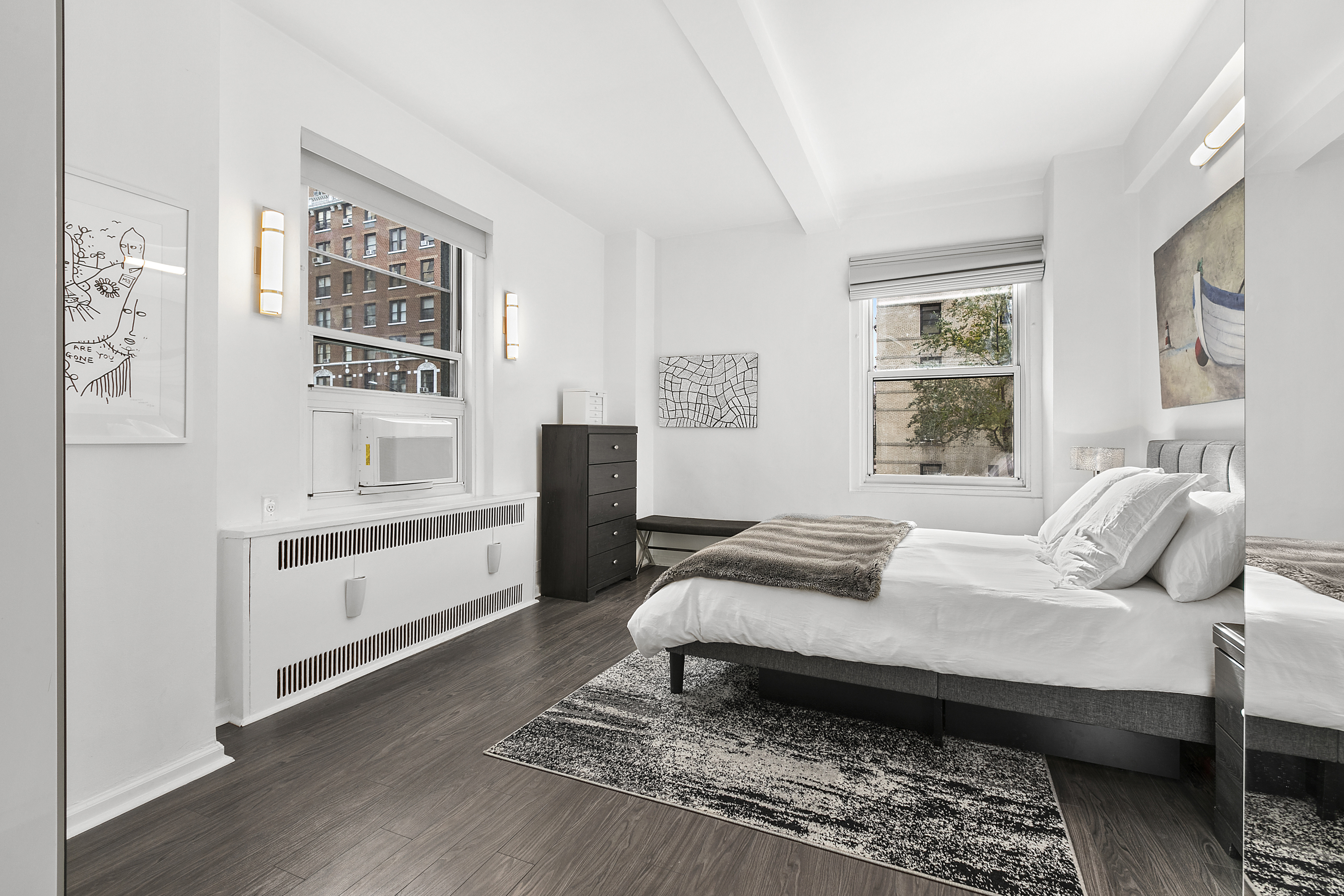 263 West End Avenue, Unit 2C Manhattan, NY 10023 - Photo 4 of 13 a bedroom with a bed and wooden floor