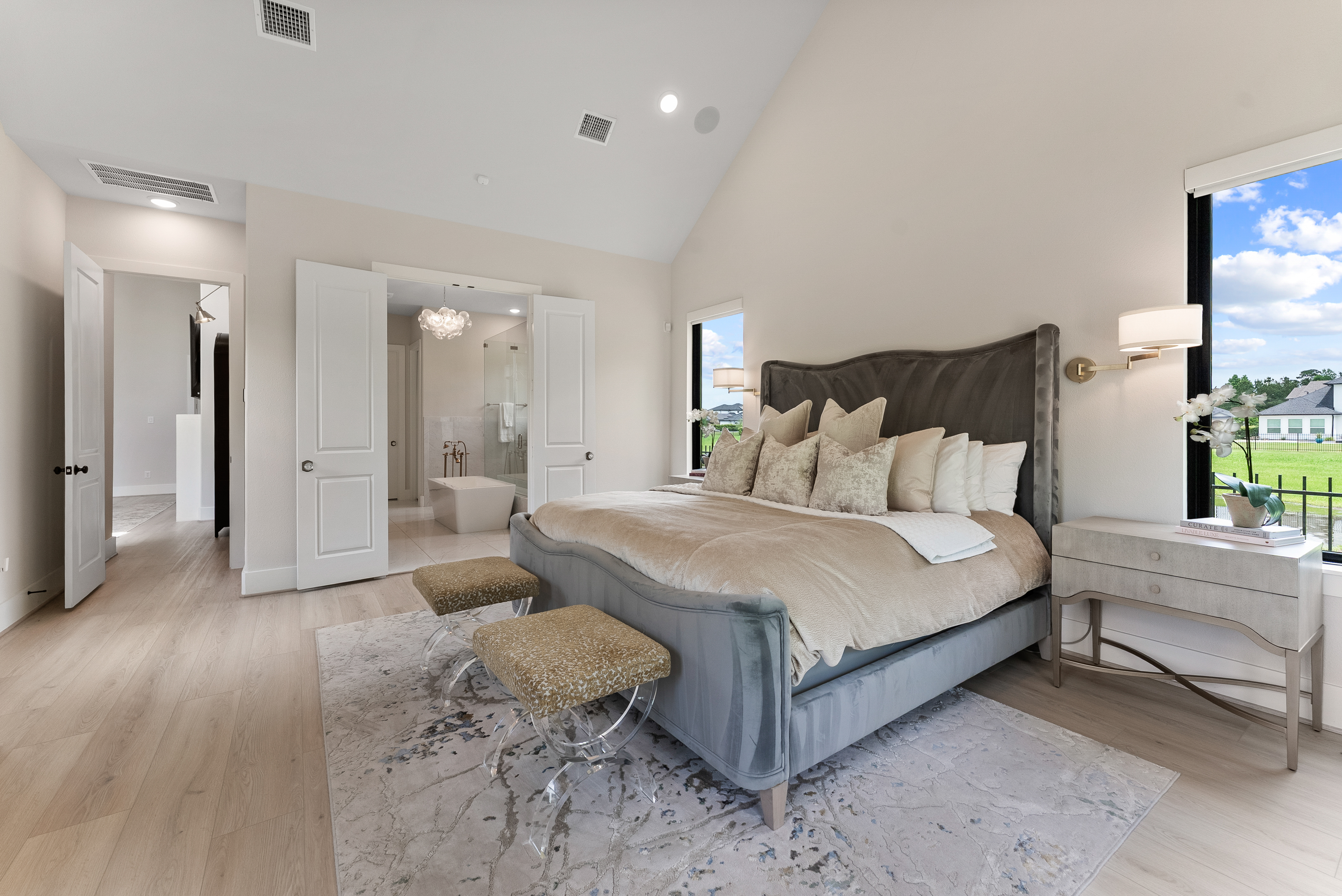 2118 Bennet Court Conroe, TX 77384 - Photo 27 of 70 a spacious bedroom with a bed and a couch