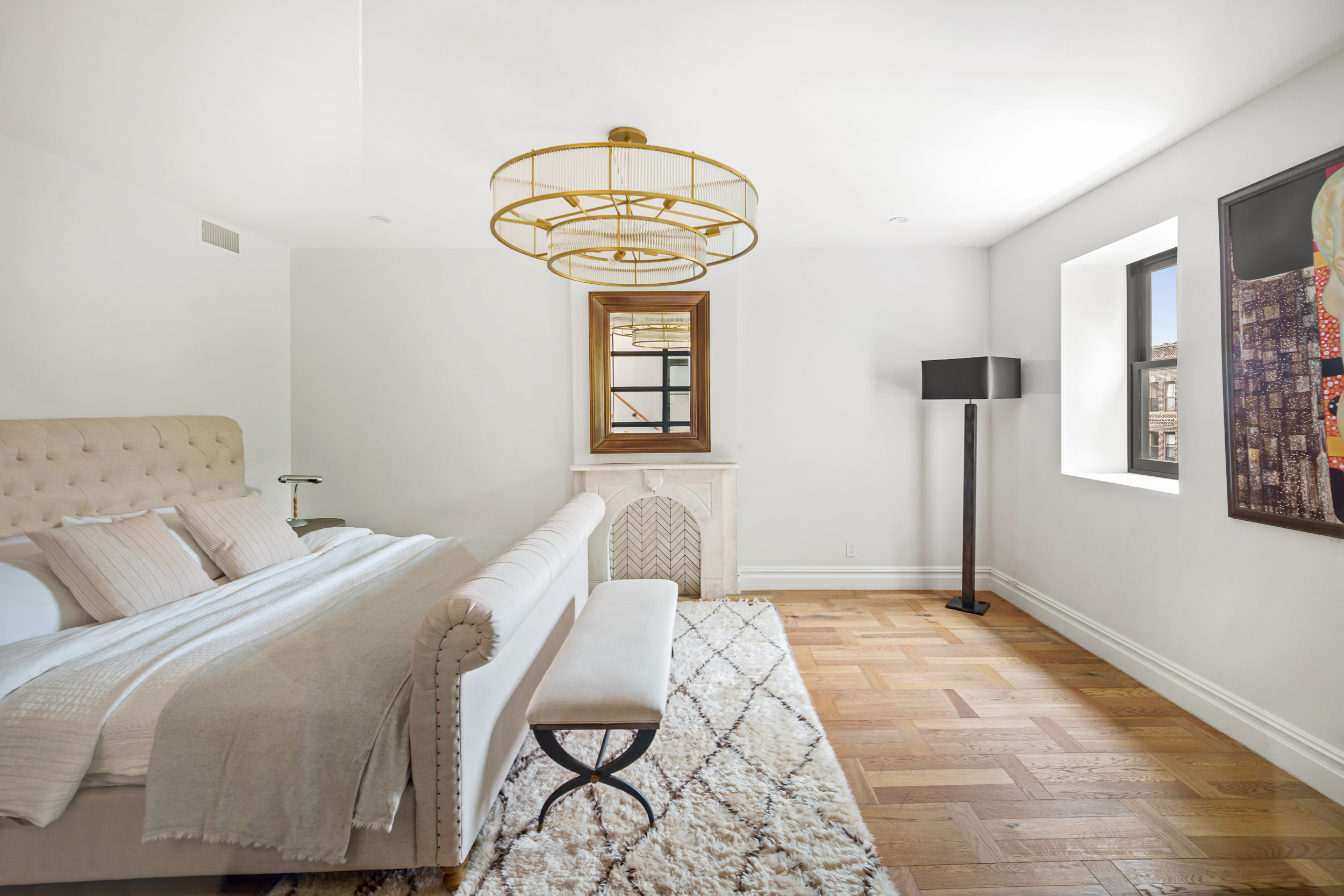 265 6th Avenue Brooklyn, NY 11215 - Photo 11 of 24 a bedroom with a bed and a window