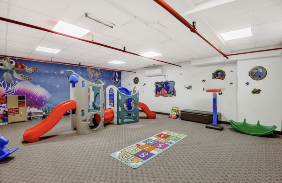 301 East 87th Street, Unit 16E Manhattan, NY 10128 - Photo 13 of 16 a children room with toys