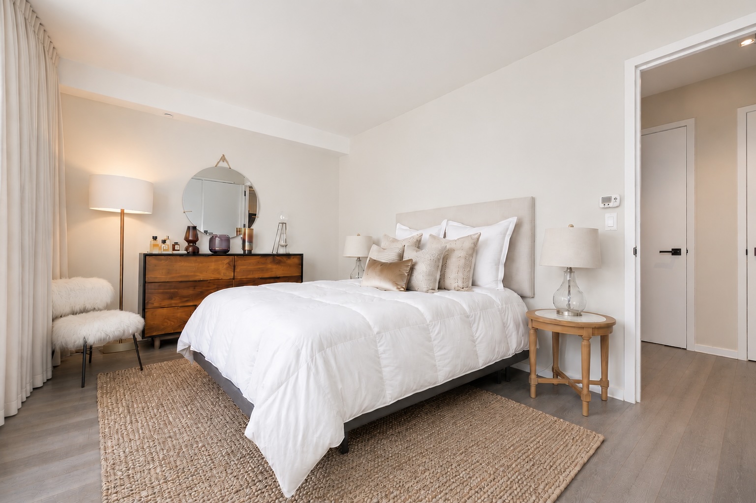 385 1st Avenue, Unit 6G Manhattan, NY 10010 - Photo 10 of 19 a bedroom with a bed and wooden floor