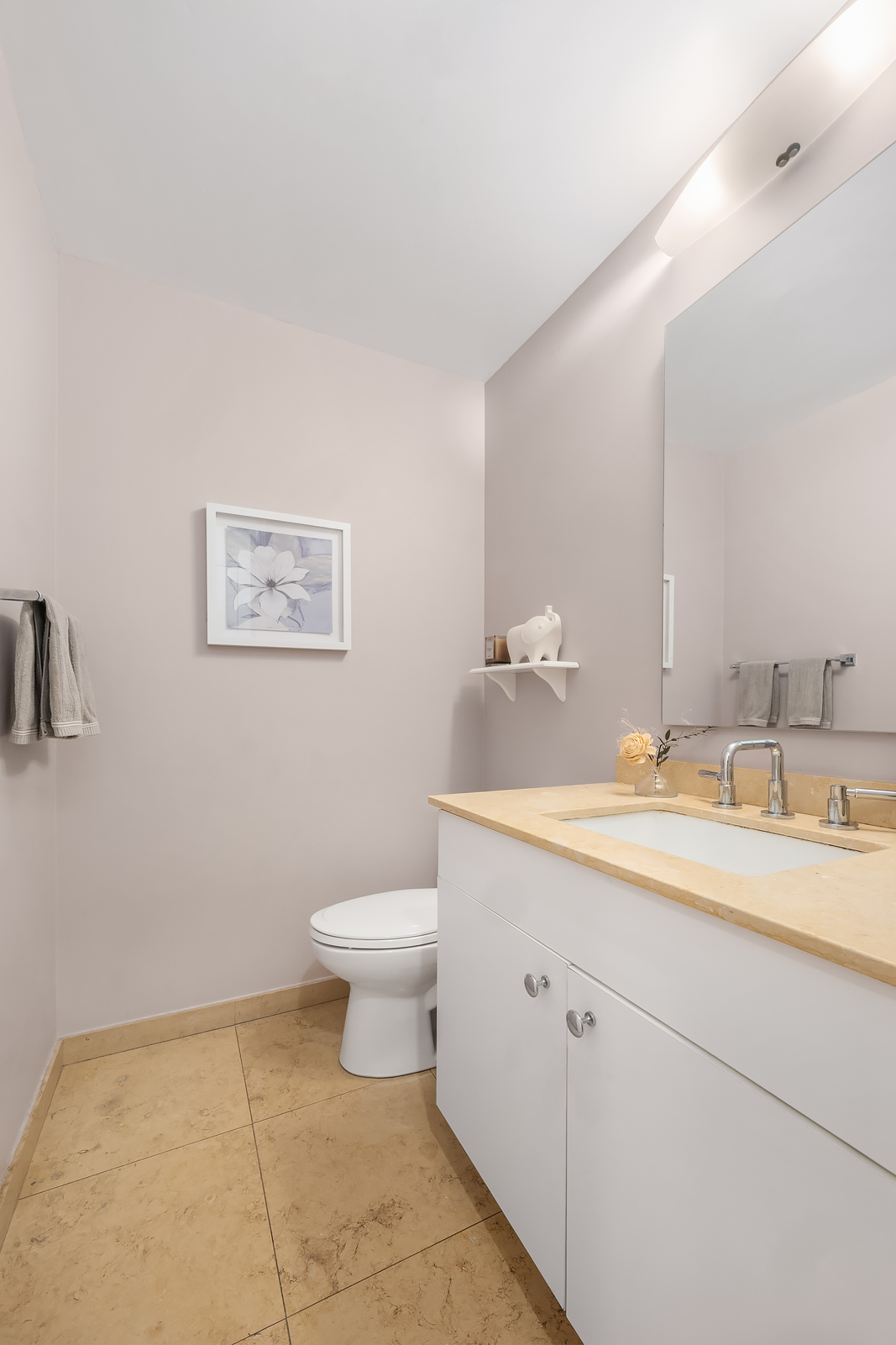 304 West 88th Street, Unit GC Manhattan, NY 10024 - Photo 12 of 16 a bathroom with a toilet sink and mirror
