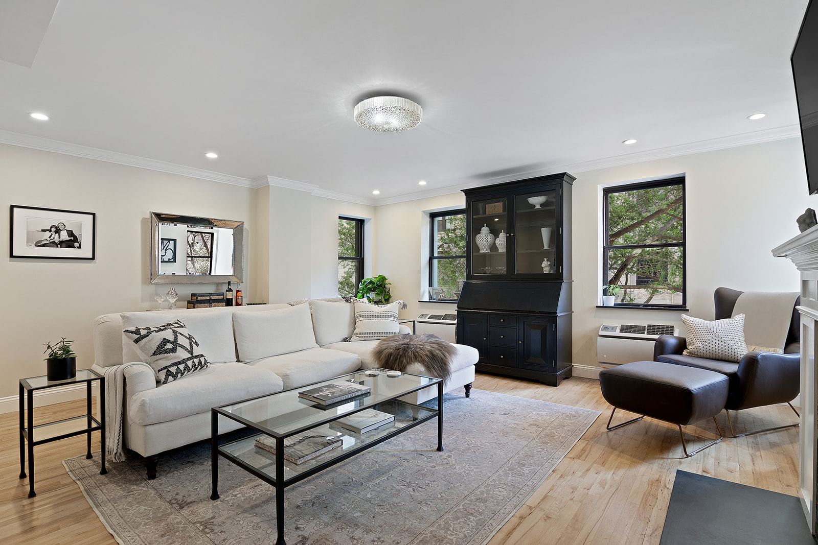 57 East 75th Street, Unit 2F Manhattan, NY 10021 - Photo 2 of 10 a living room with furniture and a couch