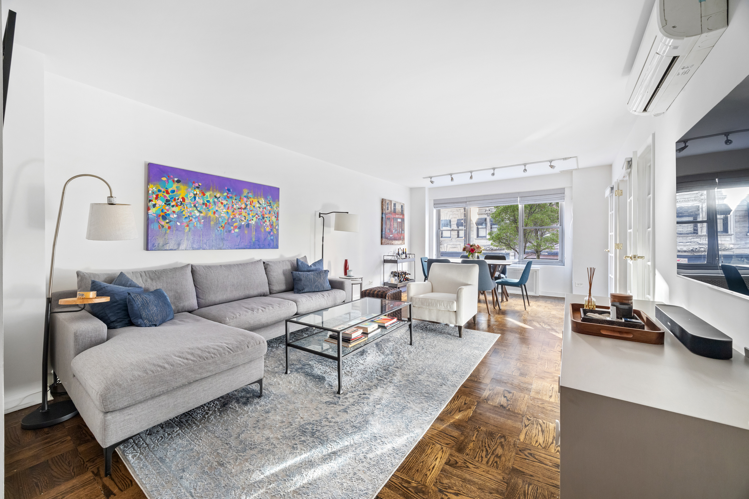 2 5th Avenue, Unit 2R Manhattan, NY 10011 - Photo 2 of 12 a living room with furniture rug and a table